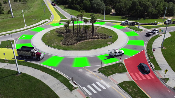 Image of trucks navigating a roundabout